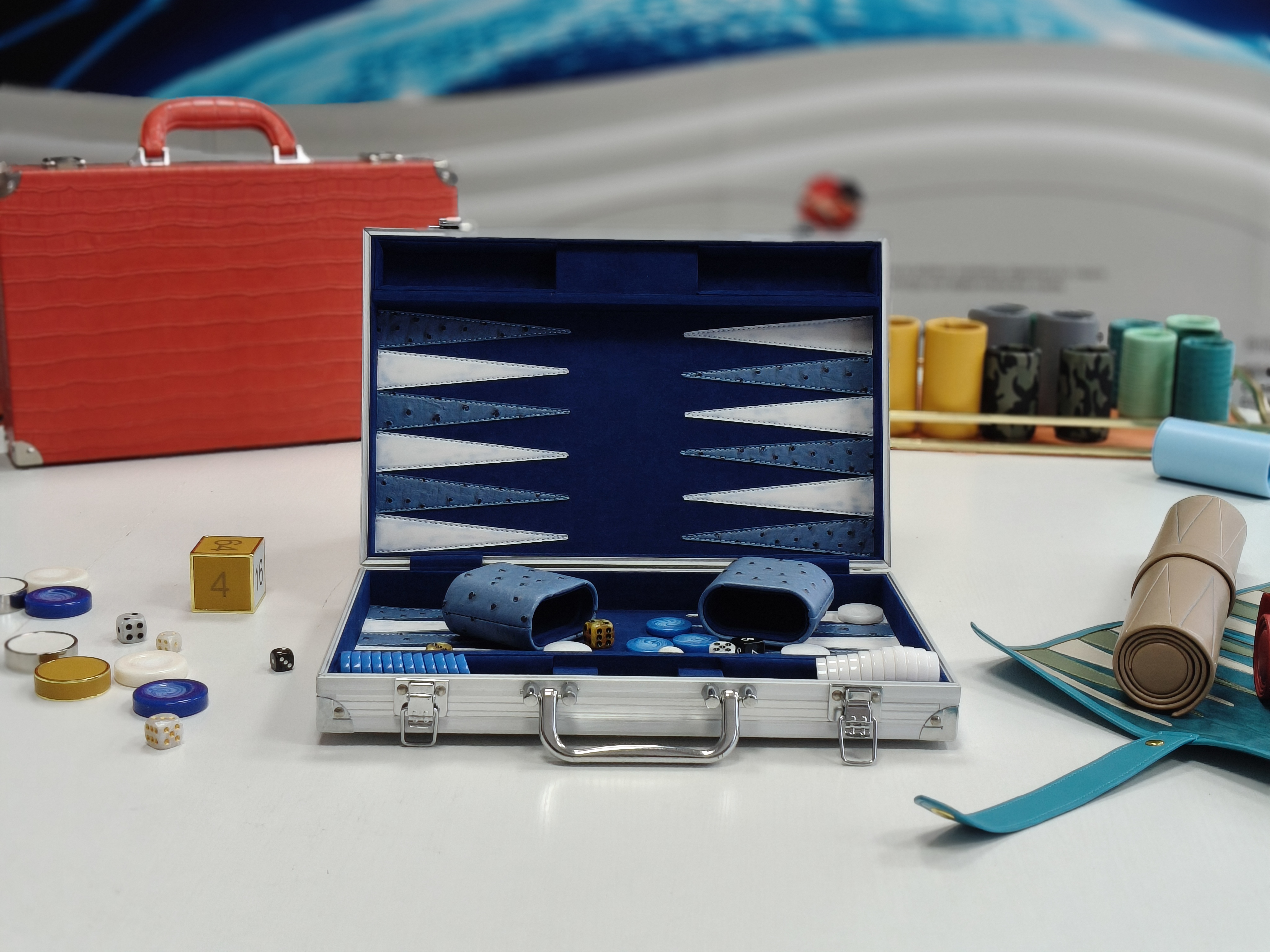 Portable aluminum frame backgammon set with folding board and smooth playing surface