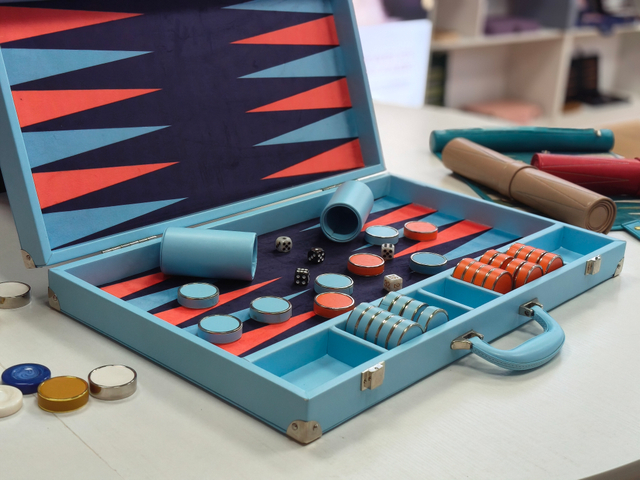 colorful backgammon set open with contrast board design