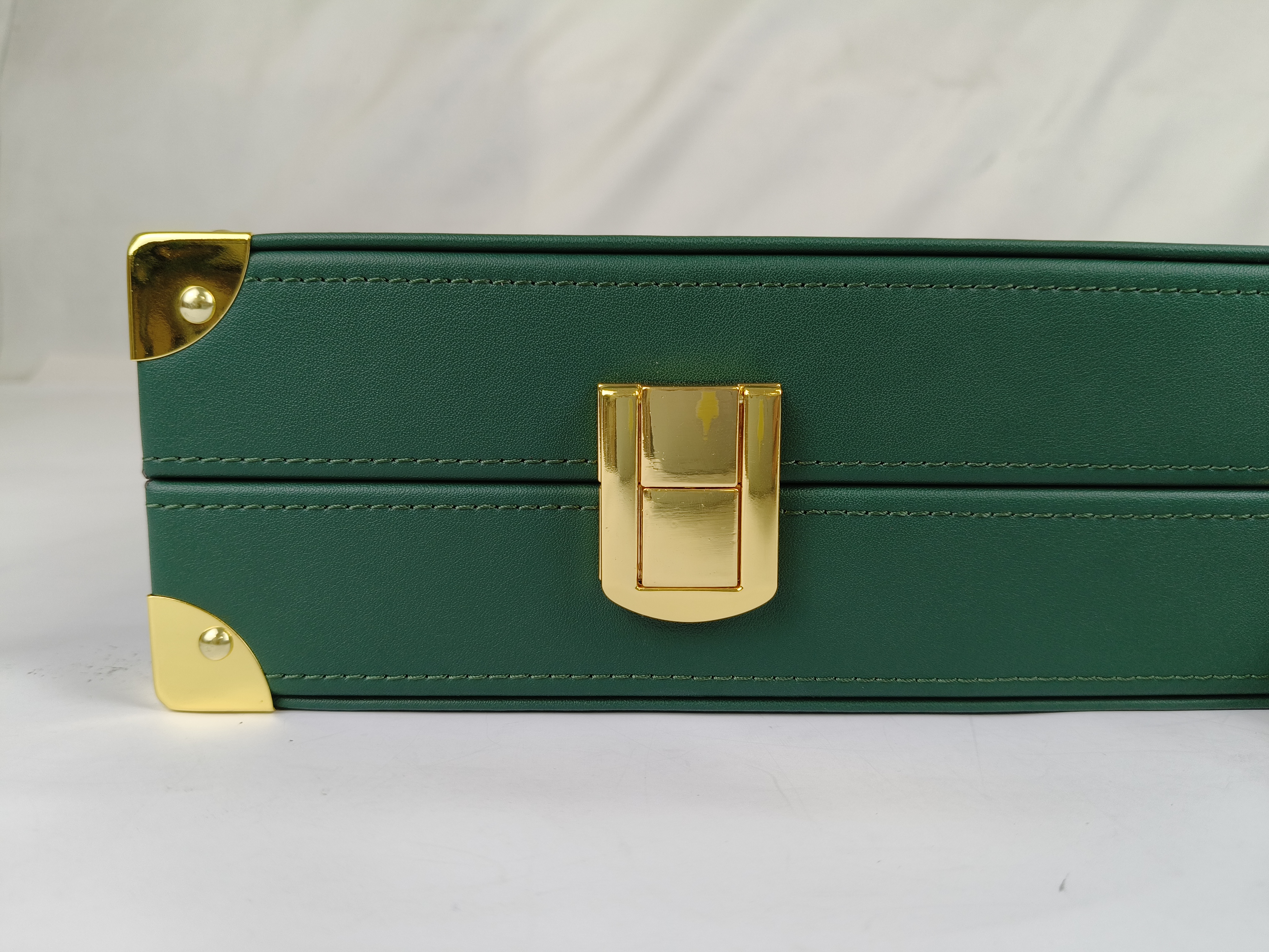Bright gold hardware protects the board.